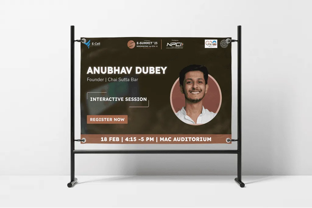 E-Summit banner on a metal stand announcing an interactive session with the founder of Chai Sutta Bar, with time, venue and a Register Now button
