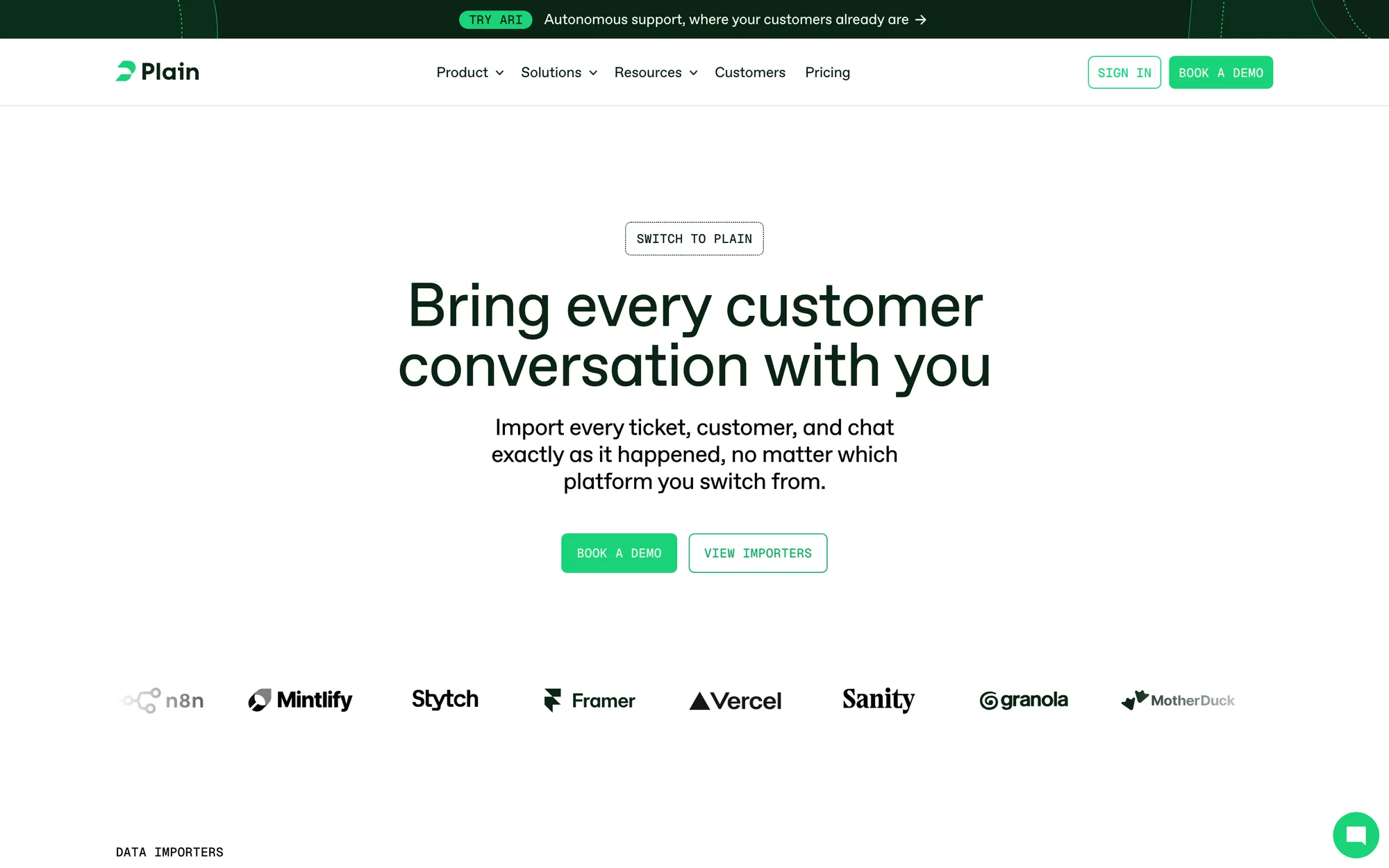 Plain migrate page with a Switch to Plain label, the headline Bring every customer conversation with you, and Book a demo and View importers buttons